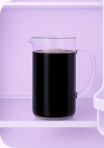 a pitcher of cold brew coffee in a fridge