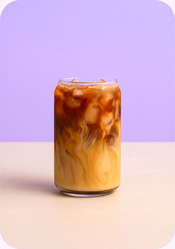 a glass of cold brew with milk in it